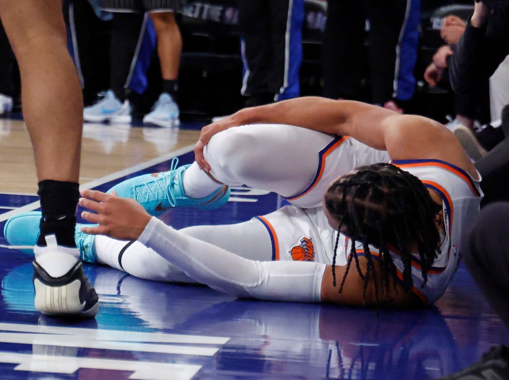 Knicks guard Jalen Brunson (11) down in pain after injuring his ankle against the Magic on Nov. 12, 2025.