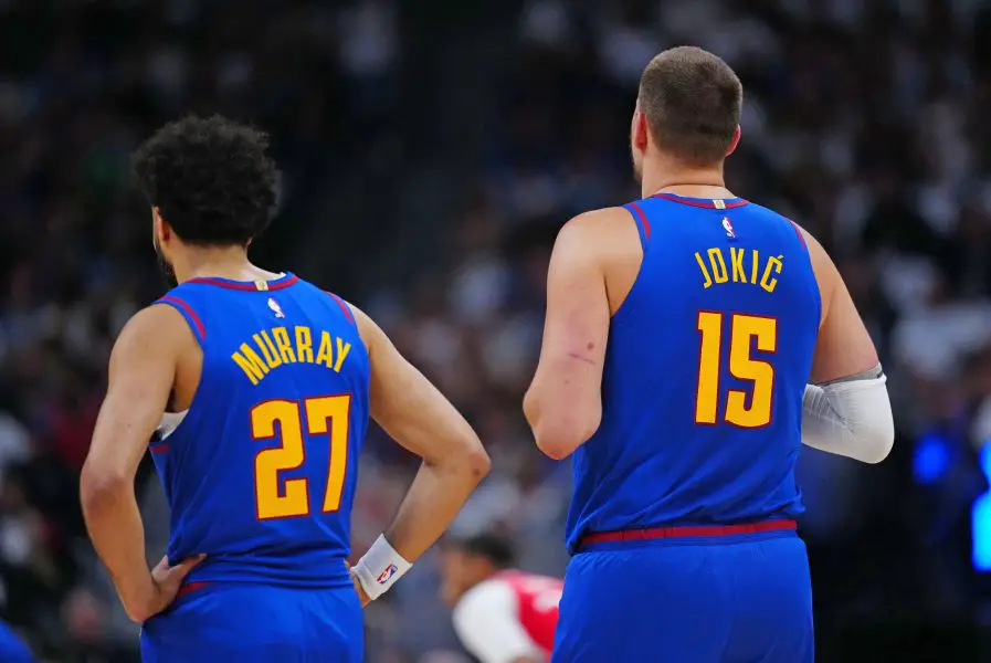 May 3, 2025; Denver, Colorado, USA; Denver Nuggets guard Jamal Murray (27) and Denver Nuggets center Nikola Jokic (15) during the first quarter against the LA Clippers during game seven of first round for the 2025 NBA Playoffs at Ball Arena. Mandatory Credit: Ron Chenoy-Imagn Images
