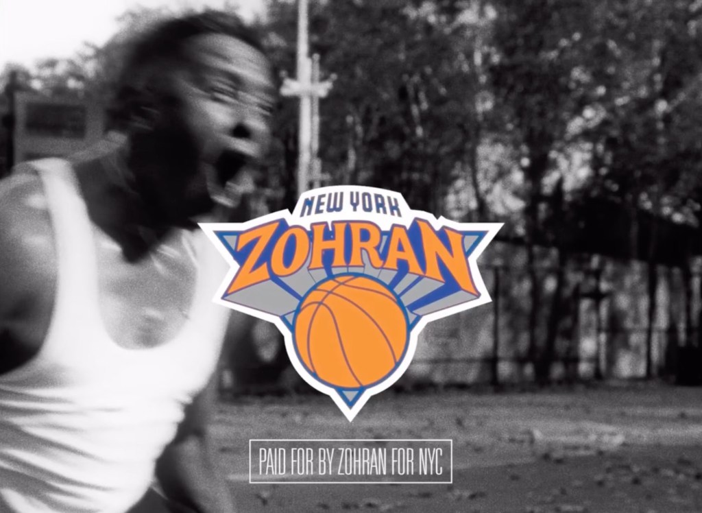 An illustration of a “New York Zohran” logo, similar to the New York Knicks logo, superimposed over a blurry, black and white image of a person.