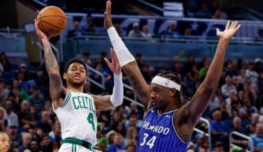 Celtics guard Anfernee Simons (4), who scored 25 points on Sunday night, shoots and is fouled by Magic center Wendell Carter Jr. (34). (AP Photo/Kevin Kolczynski)