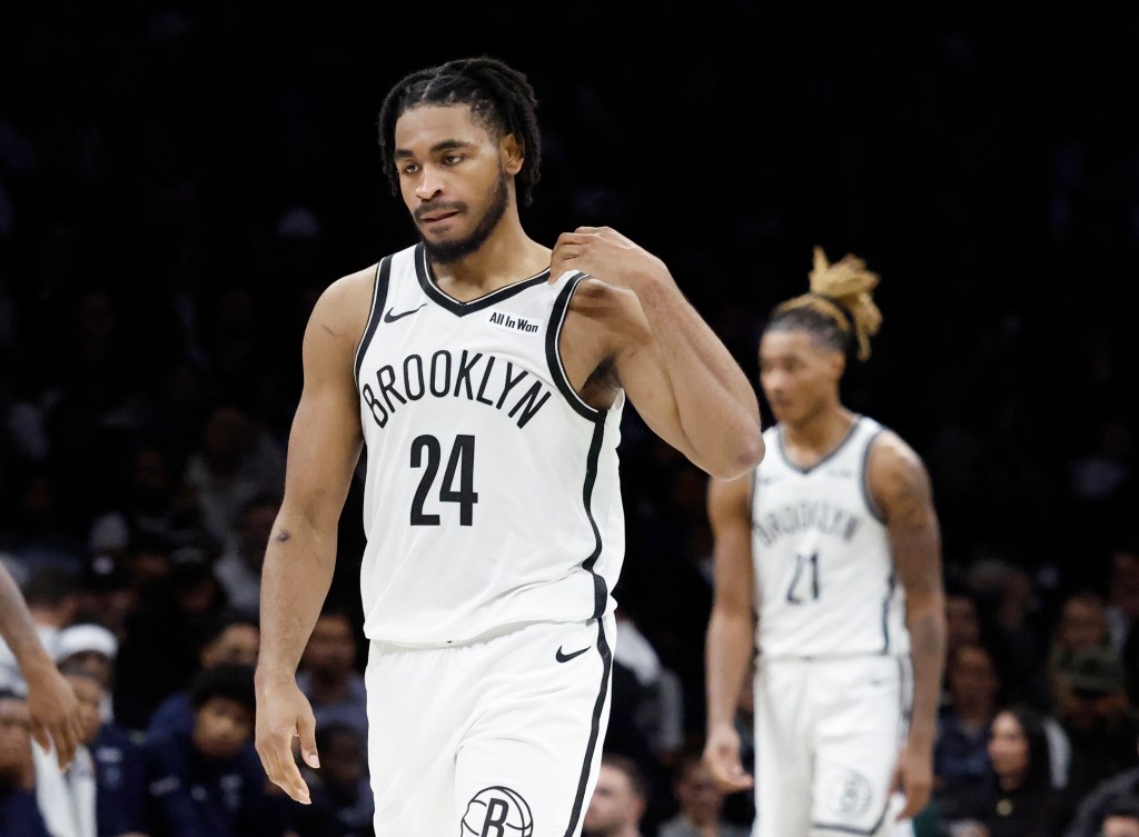 Cam Thomas (L) and teammate Brooklyn Nets forward Noah Clowney (R) walk dejectedly back to their bench during their teams play against the against the Minnesota Timberwolves in the second half at the Barclays Center in Brooklyn, New York, November 03, 2025.
