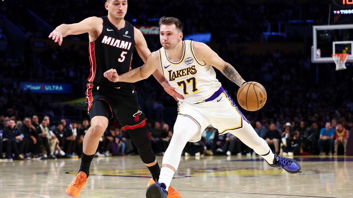 Lakers beat Heat 130-120 behind Doncic's triple-double