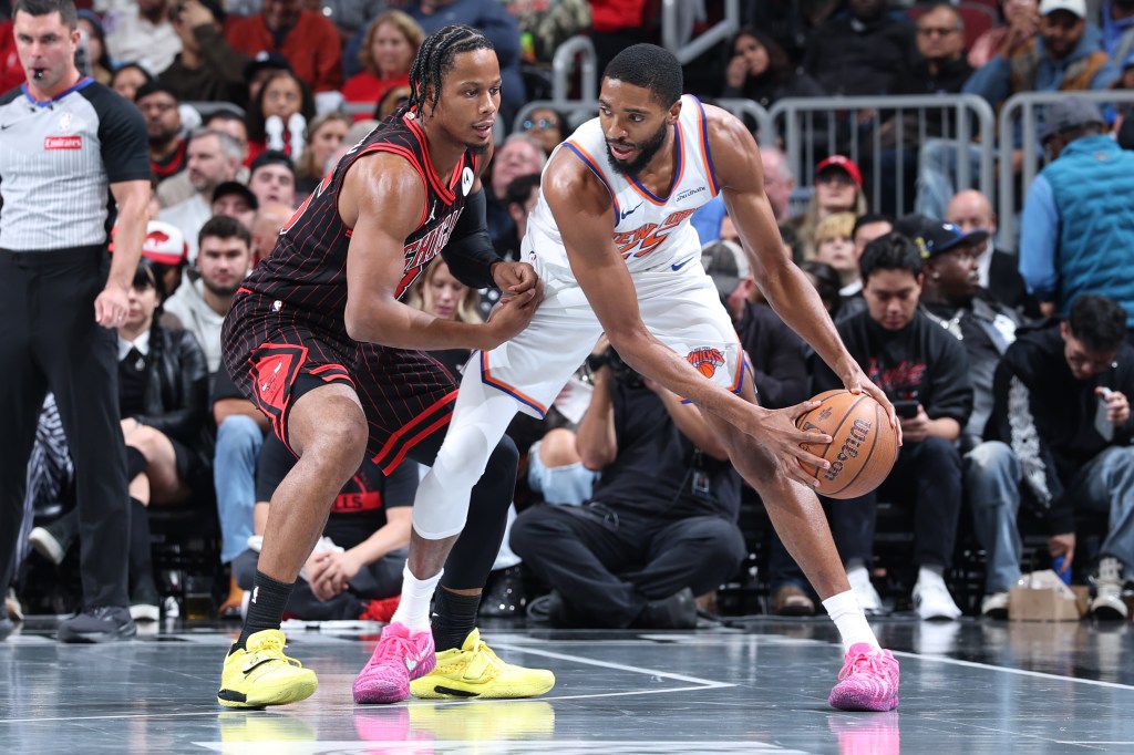 Mikal Bridges #25 of the New York Knicks handles the ball during the game against the Chicago Bulls on October 31, 2025 at United Center in Chicago, Illinois. 