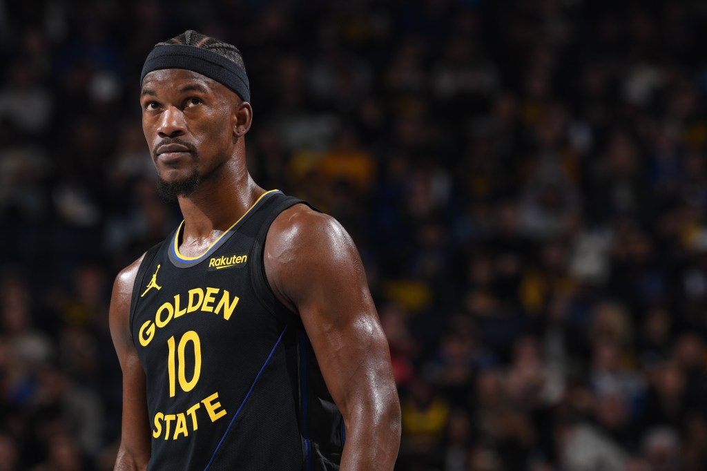 Jimmy Butler III #10 of the Golden State Warriors looking on during the game.