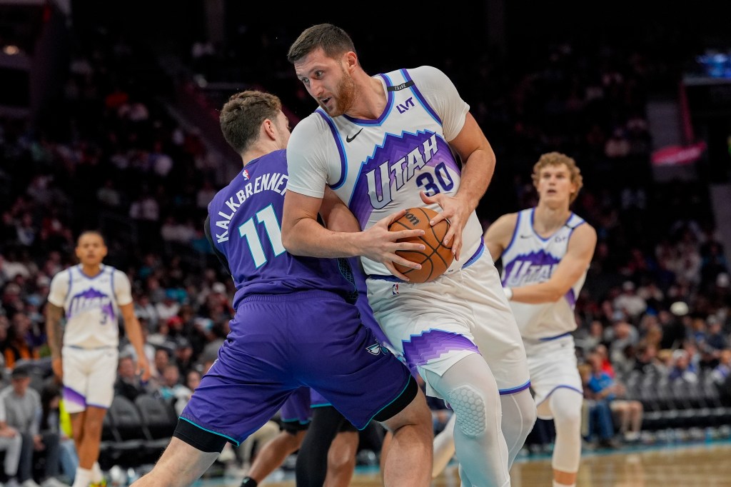 Utah Jazz center Jusuf Nurkic (30) with the ball trying to elude Charlotte Hornets center Ryan Kalkbrenner (11) during the second half at Spectrum Center.