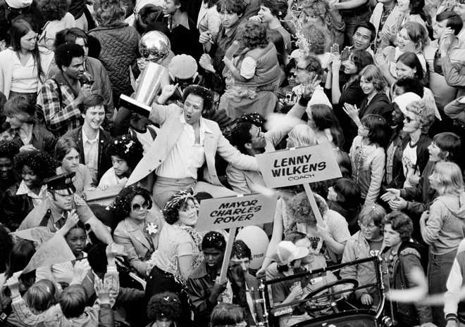 Lenny Wilkens FILE - Seattle Supersonics Coach Lenny Wilkens holds up the NBA World Championship trophy before some of the thousands of fans that lined in Seattle streets June 4, 1979 in celebration of the Sonics victory over the Washington Bullets.