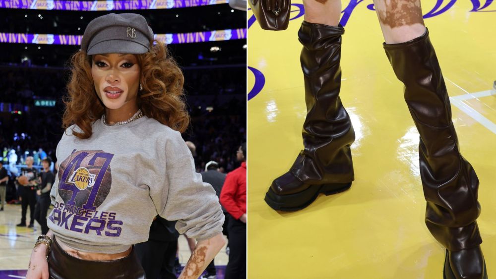Winnie Harlow embraces the slouchy boot trend in a brown over-the-knee pair at the Lakers vs. Mavericks game on Friday night.