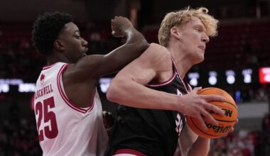 SIUE's Arnas Sakenis grabs a rebound in front of Wisconsin's John Blackwell during the first half of an NCAA college basketball game Monday, Nov. 17, 2025, in Madison, Wis.