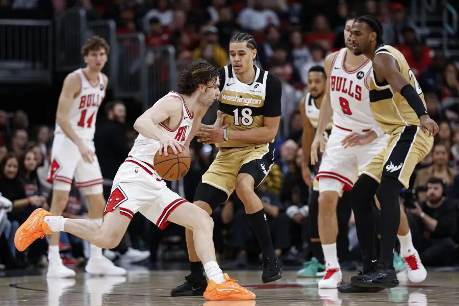 Nov 22, 2025; Chicago, Illinois, USA; Chicago Bulls guard Josh Giddey (3) drives to the basket against Washington Wizards forward Kyshawn George (18) during the second half at United Center. Mandatory Credit: Kamil Krzaczynski-Imagn Images