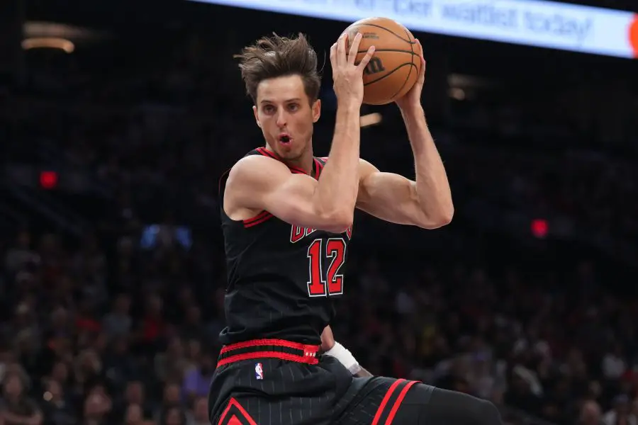 Mar 19, 2025; Phoenix, Arizona, USA; Chicago Bulls forward Zach Collins (12) grabs a rebound against the Phoenix Suns during the first half at PHX Aena. Mandatory Credit: Joe Camporeale-Imagn Images