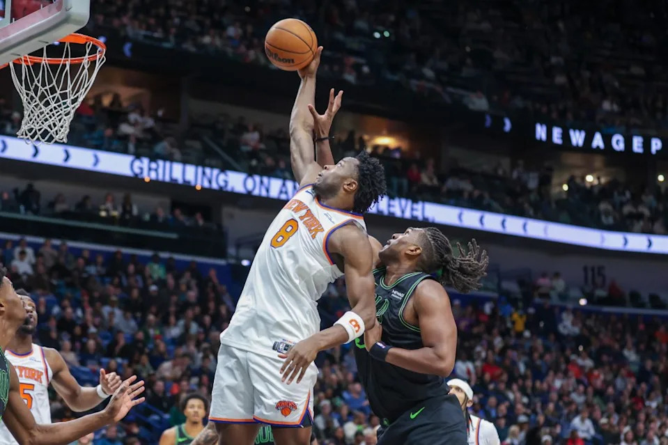 New York Knicks forward Og Anunoby (8) pulls down a defensive rebound against New Orleans Pelicans forward Kevon Looney, right, in the first half of an NBA basketball game in New Orleans, Monday, Dec. 29, 2025. AP
