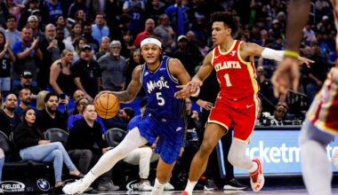 Atlanta Hawks star forward Jalen Johnson defending Orlando Magic star Paolo Banchero.