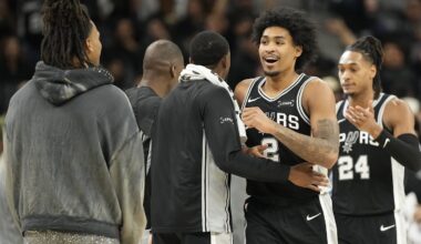 Dec 2, 2025; San Antonio, Texas, USA; San Antonio Spurs guard Dylan Harper (2) is congratulated by teammates after scoring before a timeout in the second half against the Memphis Grizzlies at Frost Bank Center. Mandatory Credit: Scott Wachter-Imagn Images