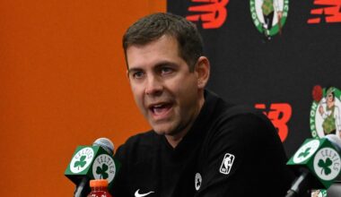 Sep 25, 2025; Boston, MA, USA;  Boston Celtics president of basketball operations Brad Stevens speaks during a press conference as co-owner and alternate governor Aditya Mittalat (black) and lead owner and governor Bill Chisholm (white) look on at Auerbach Center. Mandatory Credit: Eric Canha-Imagn Images
