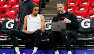 Noa Essengue of the Chicago Bulls looks on from the bench.
