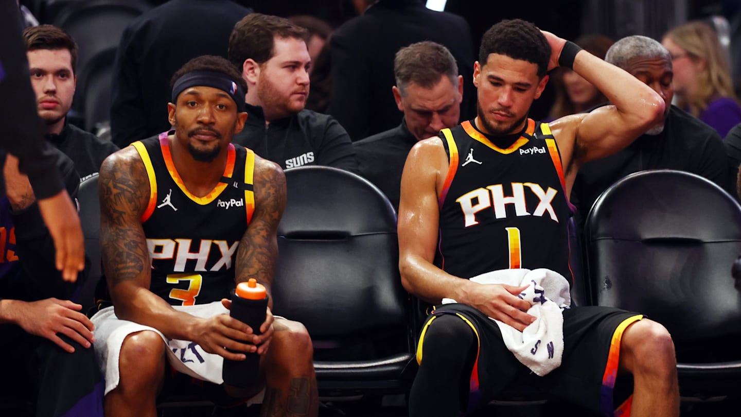 Apr 9, 2025; Phoenix, Arizona, USA; Phoenix Suns guard Bradley Beal (3) and guard Devin Booker (1) react on the bench against the Oklahoma City Thunder during the fourth quarter at Footprint Center. Mandatory Credit: Mark J. Rebilas-Imagn Images