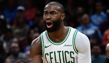 Nov 30, 2025; Cleveland, Ohio, USA; Boston Celtics guard Jaylen Brown (7) reacts after fouling Cleveland Cavaliers guard Donovan Mitchell (45) during the second half at Rocket Arena. Mandatory Credit: David Dermer-Imagn Images