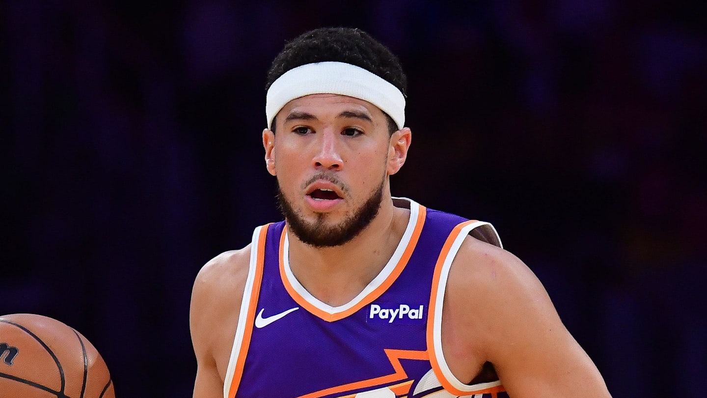 Dec 1, 2025; Los Angeles, California, USA; Phoenix Suns guard Devin Booker (1) moves the ball up court against the Los Angeles Lakers during the first half at Crypto.com Arena. Mandatory Credit: Gary A. Vasquez-Imagn Images