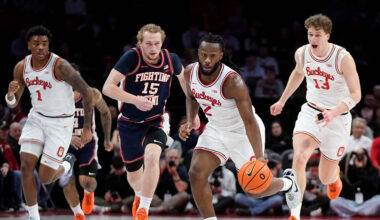 Ohio State Buckeyes guard Bruce Thornton (2) brings the ball up court past Illinois Fighting Illini forward Jake Davis (15) during the first half of the NCAA men's basketball game in Columbus on Dec. 9, 2025. Ohio State lost 86-78.