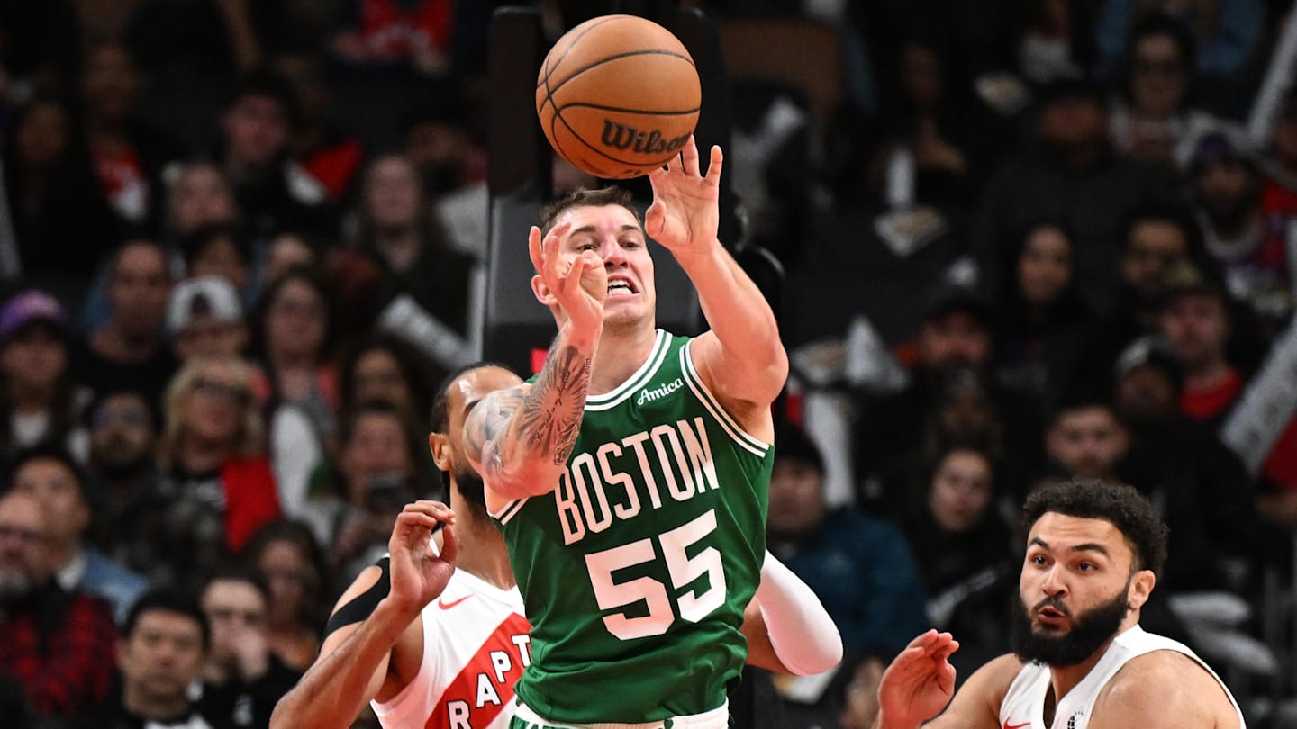 Oct 10, 2025; Toronto, Ontario, CAN;   Boston Celtics forward Baylor Scheierman (55) passes the ball against the Toronto Raptors in the second half at Scotiabank Arena.