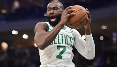 Dec 11, 2025; Milwaukee, Wisconsin, USA; Boston Celtics forward Jaylen Brown (7) grabs a rebound in the first quarter against the Milwaukee Bucks at Fiserv Forum.
