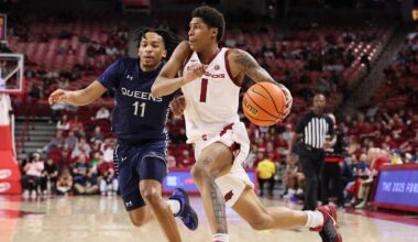 Dec 16, 2025; Fayetteville, Arkansas, USA; Arkansas Razorbacks guard Meleek Thomas (1) drives against Queens Royals guard Chris Ashby (11) during the second half at Bud Walton Arena. Arkansas won 108-80. Mandatory Credit: Nelson Chenault-Imagn Images