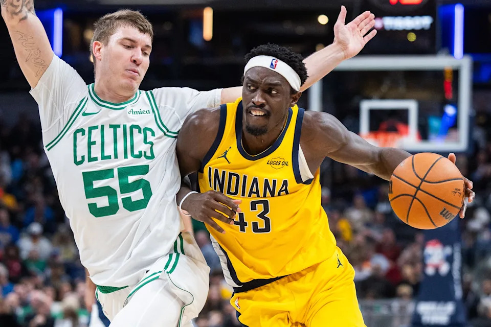 Dec 26, 2025; Indianapolis, Indiana, USA; Indiana Pacers forward Pascal Siakam (43) dribbles the ball while Boston Celtics guard Baylor Scheierman (55) defends in the first half at Gainbridge Fieldhouse. Mandatory Credit: Trevor Ruszkowski-Imagn Images