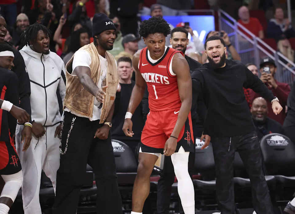 Dec 11, 2025; Houston, Texas, USA; Houston Rockets guard Amen Thompson (1) is congratulated by teammates after a play during the fourth quarter against the Los Angeles Clippers at Toyota Center. Mandatory Credit: Troy Taormina-Imagn Images