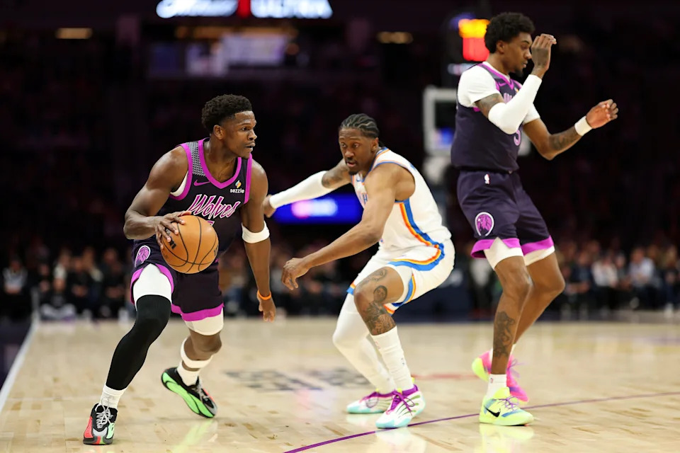 MINNEAPOLIS, MINNESOTA - DECEMBER 19: Anthony Edwards #5 of the Minnesota Timberwolves dribbles the ball against Jalen Williams #8 of the Oklahoma City Thunder in the first quarter at Target Center on December 19, 2025 in Minneapolis, Minnesota. NOTE TO USER: User expressly acknowledges and agrees that, by downloading and or using this photograph, User is consenting to the terms and conditions of the Getty Images License Agreement. (Photo by David Berding/Getty Images)