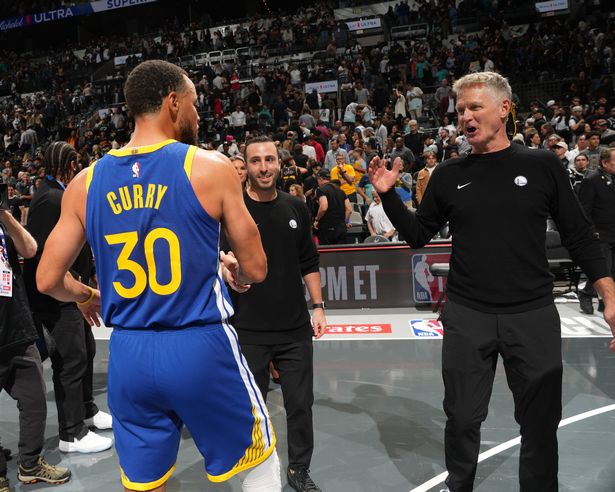 Stephen Curry #30 and Head Coach Steve Kerr of the Golden State Warriors