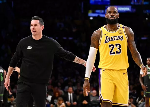 Head coach JJ Redick of the Los Angeles Lakers high fives LeBron #23 of the Los Angeles Lakers in the first half of game 5 of a first round NBA basketball game against the Minnesota Timberwolvesat Crypto.com Arena in Los Angeles on Wednesday, April 30, 2025