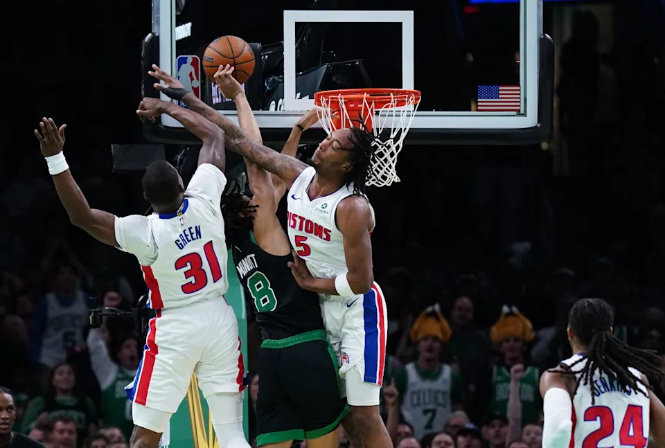 Detroit Pistons forward Ronald Holland II (5) and guard Javonte Green (31) defend against Boston Celtics forward Josh Minott (8) in the first half at TD Garden in Boston on Wednesday, Nov. 26, 2025.