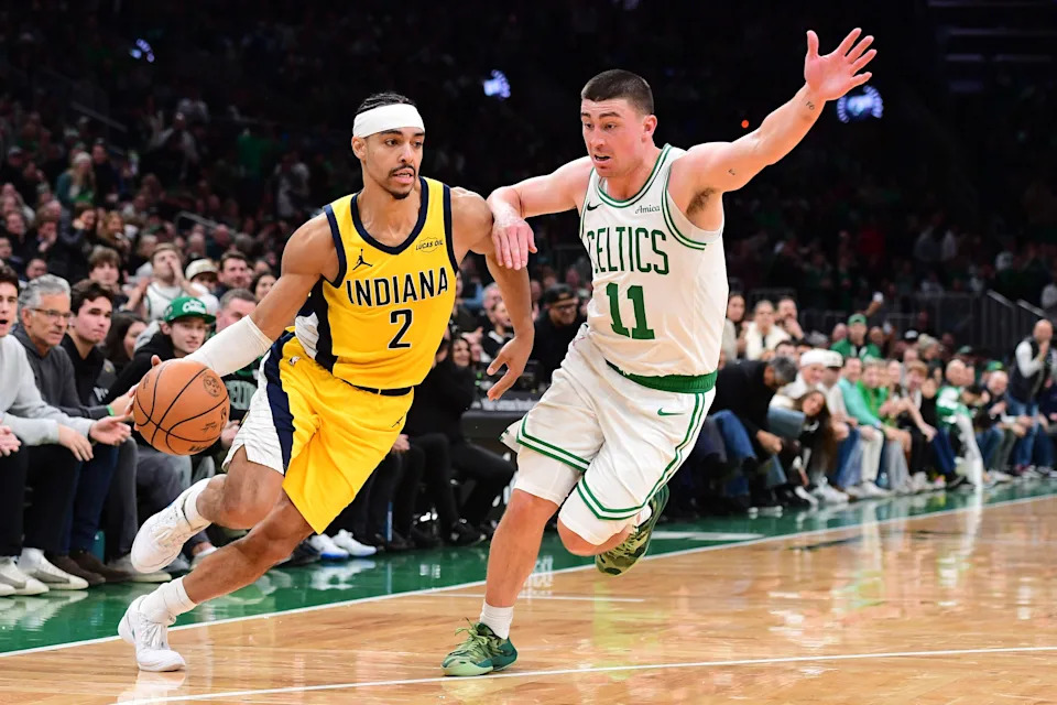 Dec 22, 2025; Boston, Massachusetts, USA; Boston Celtics guard Payton Pritchard (11) defends Indiana Pacers guard Andrew Nembhard (2) during the second half at TD Garden. Mandatory Credit: Bob DeChiara-Imagn Images