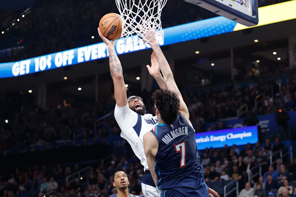 Dec 5, 2025; Oklahoma City, Oklahoma, USA; Dallas Mavericks forward Anthony Davis (3) shoots as Oklahoma City Thunder center Chet Holmgren (7) defends during the second quarter at Paycom Center. Mandatory Credit: Alonzo Adams-Imagn Images