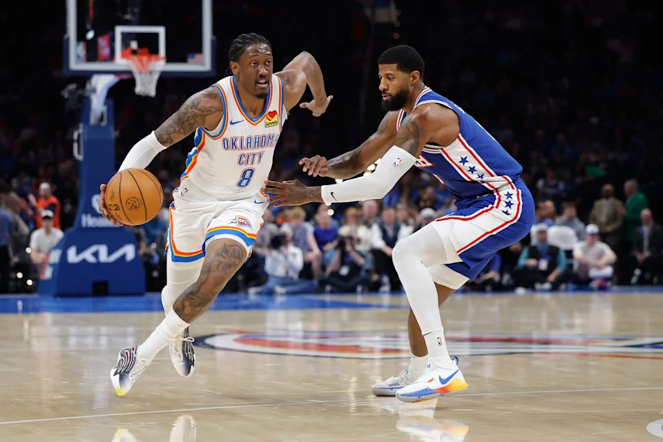 Dec 28, 2025; Oklahoma City, Oklahoma, USA; Oklahoma City Thunder guard Jalen Williams (8) drives down the court around Philadelphia 76ers forward Paul George (8) during the second half at Paycom Center. Mandatory Credit: Alonzo Adams-Imagn Images