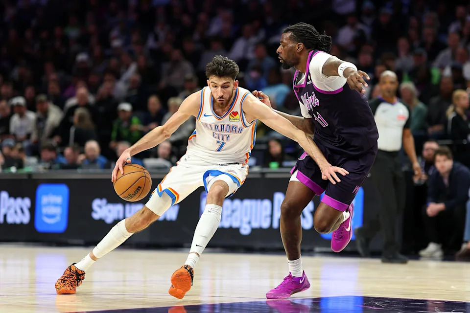 MINNEAPOLIS, MINNESOTA - DECEMBER 19: Chet Holmgren #7 of the Oklahoma City Thunder drives to the basket against Naz Reid #11 of the Minnesota Timberwolves in the fourth quarter at Target Center on December 19, 2025 in Minneapolis, Minnesota. The Timberwolves defeated the Thunder 112-107. NOTE TO USER: User expressly acknowledges and agrees that, by downloading and or using this photograph, User is consenting to the terms and conditions of the Getty Images License Agreement. (Photo by David Berding/Getty Images)