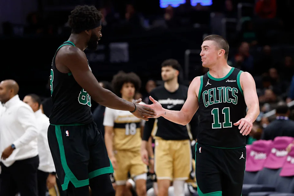 Dec 4, 2025; Washington, District of Columbia, USA; Boston Celtics guard Payton Pritchard (11) celebrates with Celtics center Neemias Queta (88) against the Washington Wizards in the second half at Capital One Arena. Mandatory Credit: Geoff Burke-Imagn Images