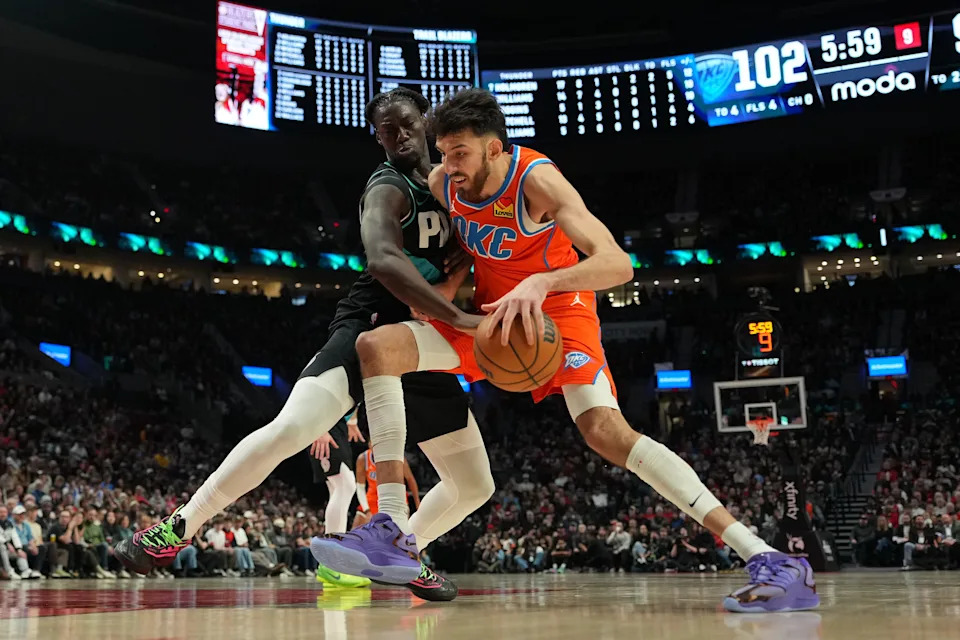 PORTLAND, OREGON - NOVEMBER 30: Chet Holmgren #7 of the Oklahoma City Thunder handles the ball against Sidy Cissoko #91 of the Portland Trail Blazers during the second half at Moda Center on November 30, 2025 in Portland, Oregon. NOTE TO USER: User expressly acknowledges and agrees that, by downloading and or using this photograph, User is consenting to the terms and conditions of the Getty Images License Agreement. (Photo by Soobum Im/Getty Images)
