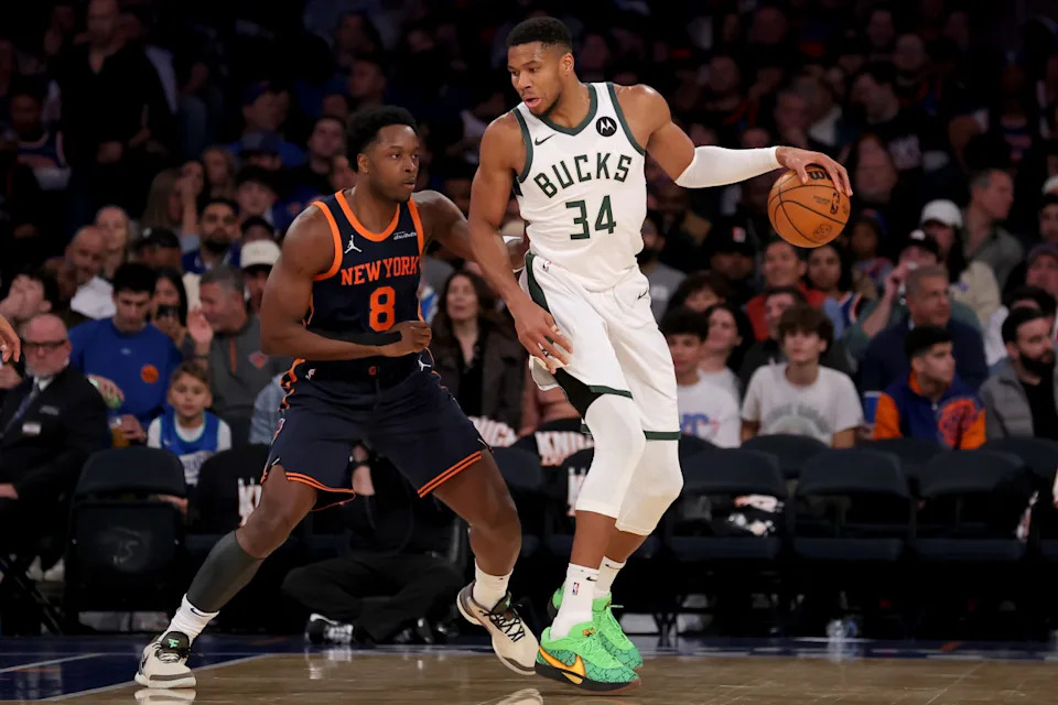 Milwaukee Bucks forward Giannis Antetokounmpo (34) controls the ball against New York Knicks forward OG Anunoby (8)Brad Penner-Imagn Images