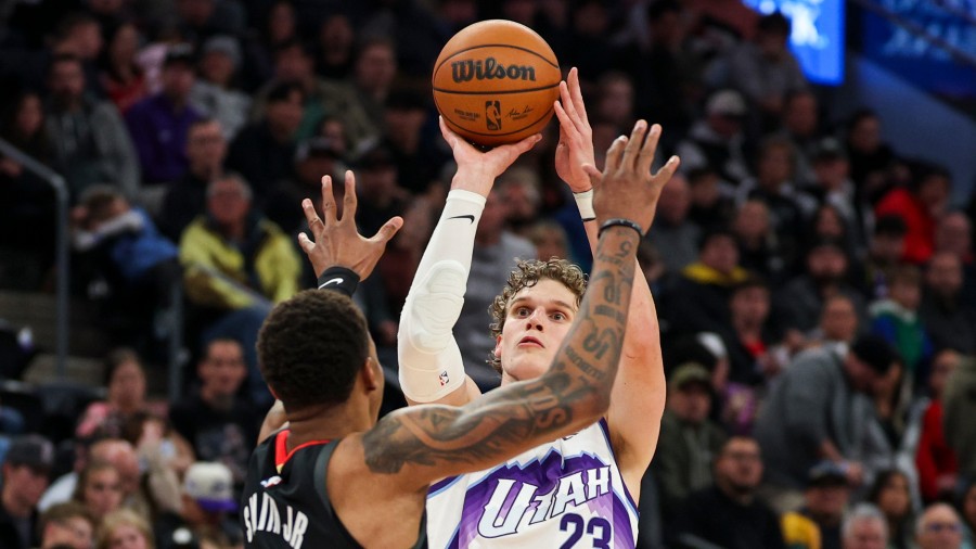 Utah Jazz forward Lauri Markkanen (23) shoots a three pointer over Houston Rockets forward Jabari S...