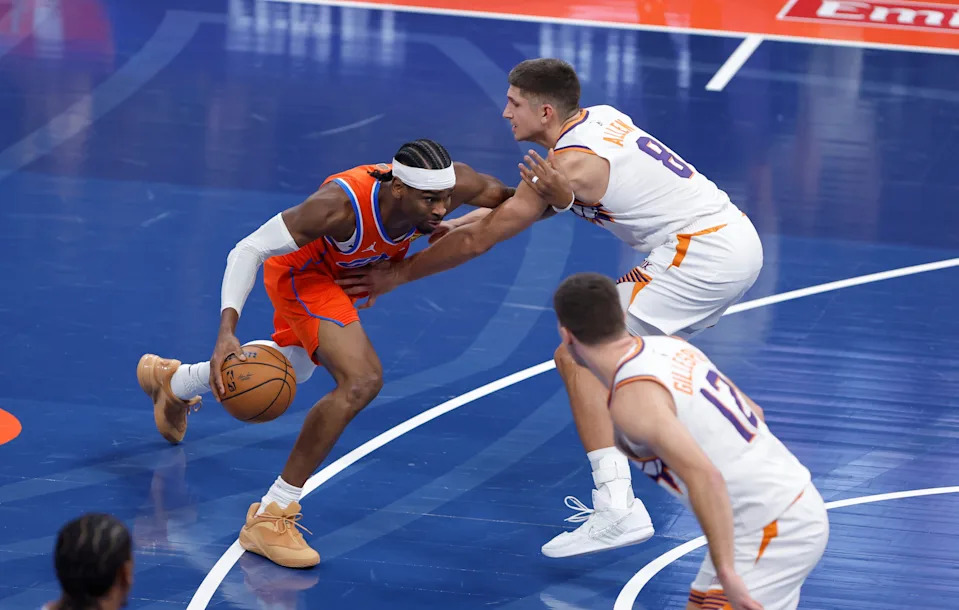 Dec 10, 2025; Oklahoma City, Oklahoma, USA; Oklahoma City Thunder guard Shai Gilgeous-Alexander (2) moves the ball past Phoenix Suns guard Grayson Allen (8) during the first quarter at Paycom Center. Mandatory Credit: Alonzo Adams-Imagn Images