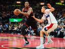 Toronto Raptors' RJ Barrett drives past Washington Wizards' Kyshawn George during a game in November.