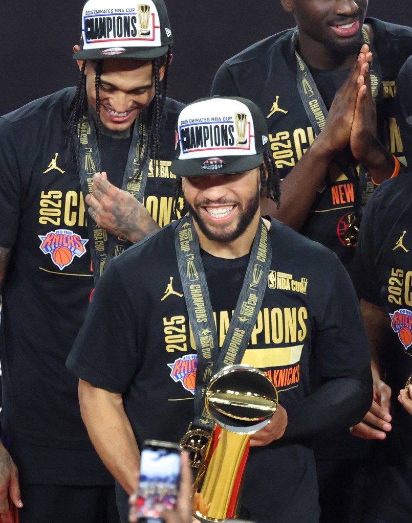 Jalen Brunson #11 of the New York Knicks is all smiles after he is presented with the NBA Cup MVP trophy after winning the NBA Cup.