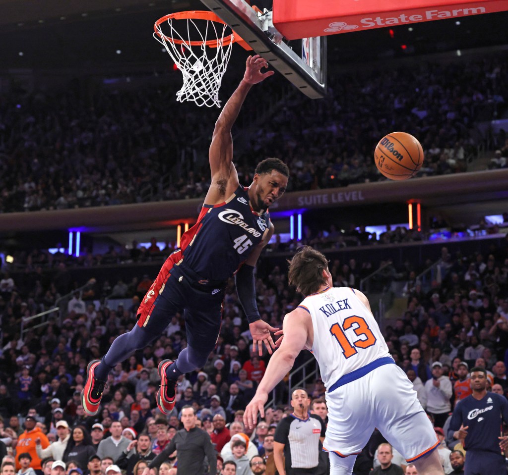 New York Knicks guard Tyler Kolek #13, strips the ball from Cleveland Cavaliers guard Donovan Mitchell #45, in the fourth quarter.