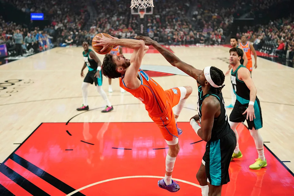 PORTLAND, OREGON - NOVEMBER 30: Chet Holmgren #7 of the Oklahoma City Thunder shoots under pressure from Jerami Grant #9 of the Portland Trail Blazers during the first half at Moda Center on November 30, 2025 in Portland, Oregon. NOTE TO USER: User expressly acknowledges and agrees that, by downloading and or using this photograph, User is consenting to the terms and conditions of the Getty Images License Agreement. (Photo by Soobum Im/Getty Images)