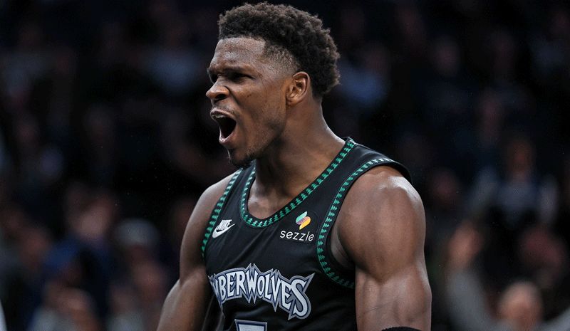 Minnesota Timberwolves guard Anthony Edwards (5) celebrates his basket against the San Antonio Spurs during the second half at Target Center.