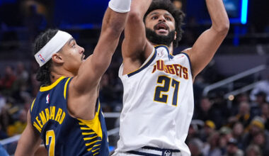 Denver Nuggets guard Jamal Murray (27) shoots over Indiana Pacers guard Andrew Nembhard (2) during the second half of an NBA basketball game in Indianapolis, Wednesday, Dec. 3, 2025. (AP Photo/Michael Conroy)