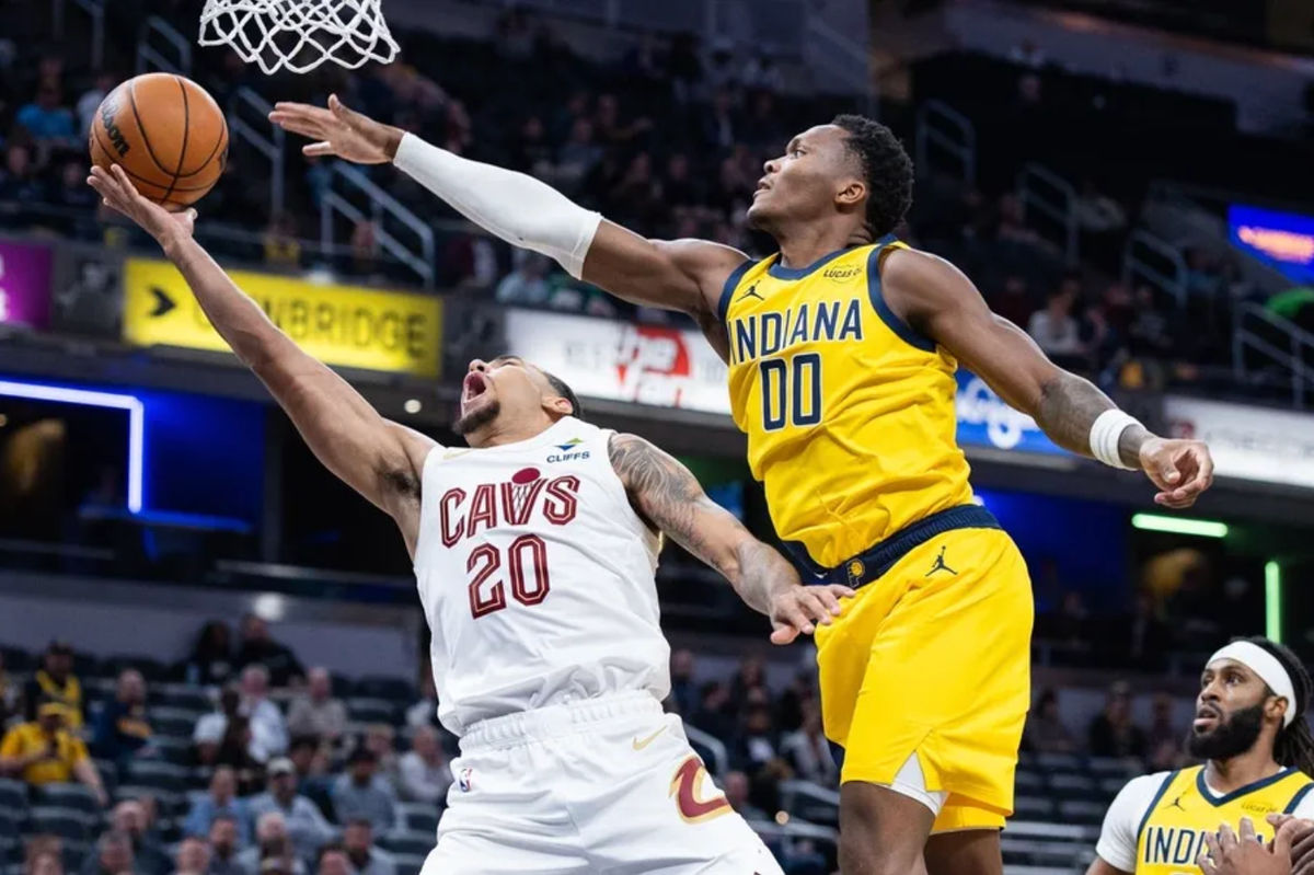Dec 1, 2025; Indianapolis, Indiana, USA; Cleveland Cavaliers guard Jaylon Tyson (20) shoots the ball while Indiana Pacers guard Bennedict Mathurin (00) defends in the first half at Gainbridge Fieldhouse. Mandatory Credit: Trevor Ruszkowski-Imagn Images