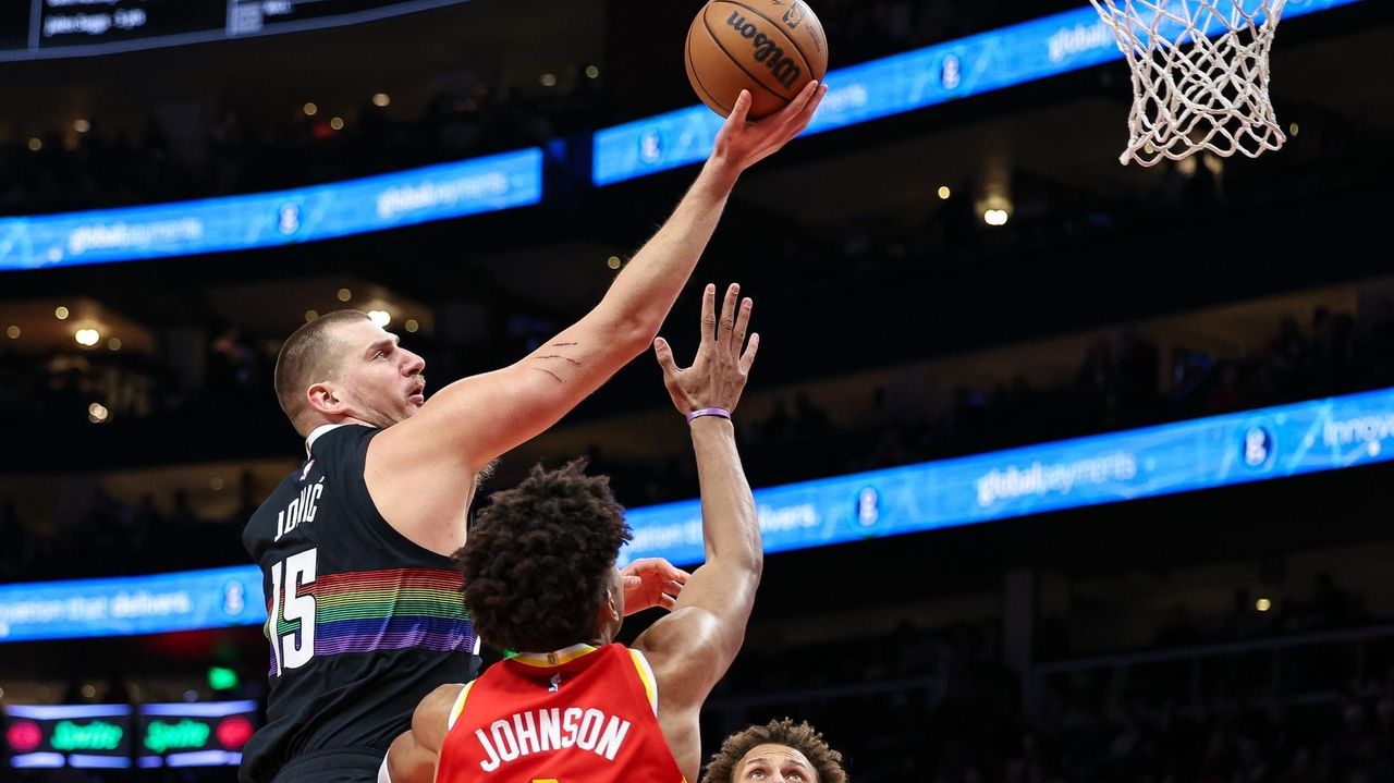 Jokic scores 39 points as Nuggets use big fourth quarter to rally for 134-133 win over Hawks