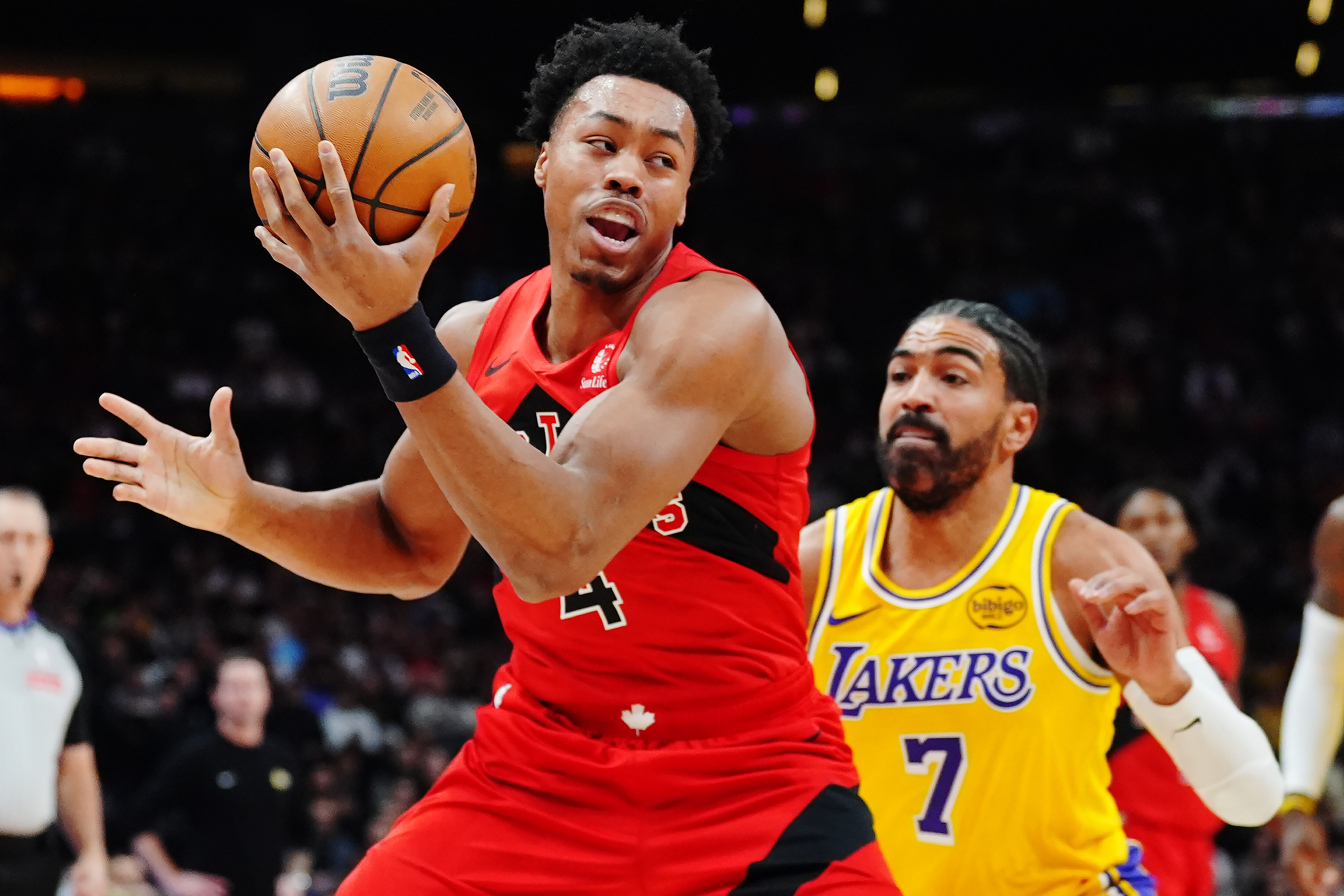 The Toronto Raptors’ Scottie Barnes protects the ball as Lakers...